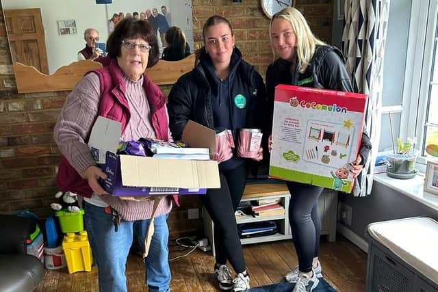Jeanette Walsh collects gifts from B F Brickwork Ltd in Corby