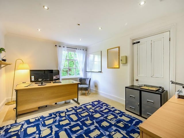 This Victorian home has a tennis court, huge gardens and a private mooring on the River Nene.