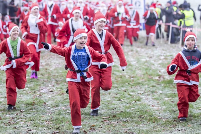 Hundreds of runners dressed as Santa braved the cold to run five kilometres for charity on Sunday December 11.