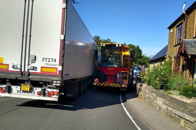 Passing lorries stuck at the pinch point in the village, on an acute bend towards Banbury. Credit: Farthinghoe Parish Council