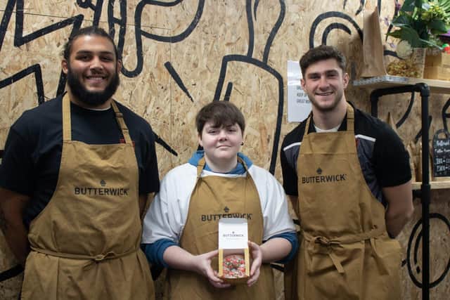 Pictured at the launch of The Big Bauble doughnut at Northampton's Butterwick Bakery is student, Callum and foundation ambassadors, Lewis Ludlam and James Grayson