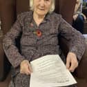 A Resident getting ready to read her chosen poem for the service