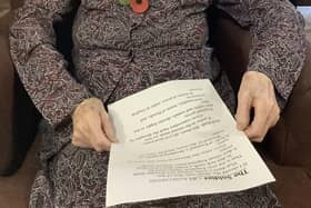 A Resident getting ready to read her chosen poem for the service