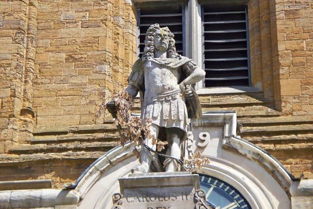How can we talk about how Charles saved the town without also thinking his role in the Atlantic Trade?