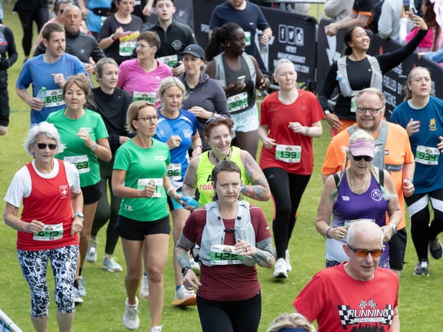 Hundreds of runners braved showers and wind to take on the race on Sunday (May 25), which started and finished at Sixfields stadium.