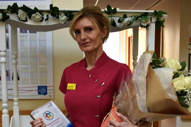 Heather Gonsalvereceives her ROSE award