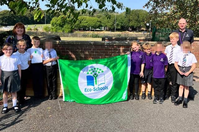 Pupils and staff at Hazel Leys Academy celebrating eco-school award