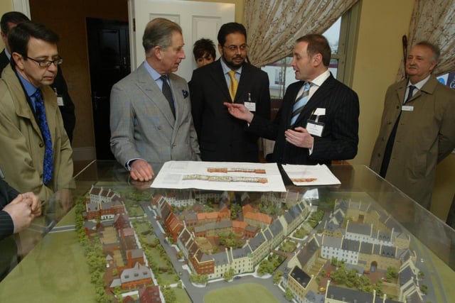 Prince Charles talking to developer Paul Newman beside a model of the new Upton village