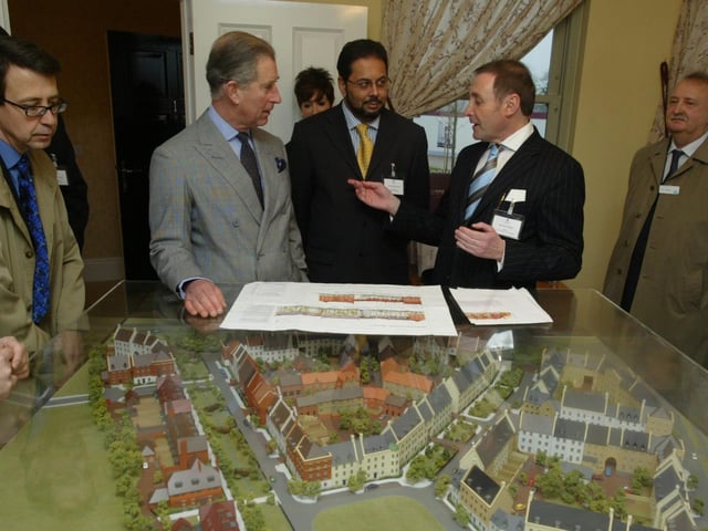 Prince Charles talking to developer Paul Newman beside a model of the new Upton village
