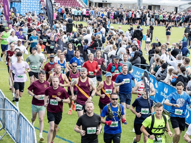 Hundreds of runners braved showers and wind to take on the race on Sunday (May 25), which started and finished at Sixfields stadium.