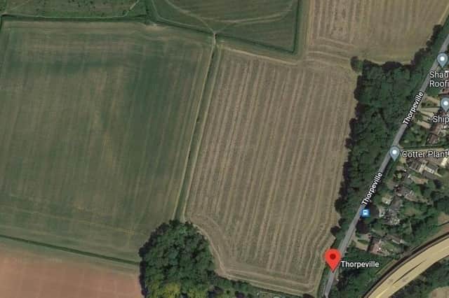 The fields on the left of this image is where the school is being built