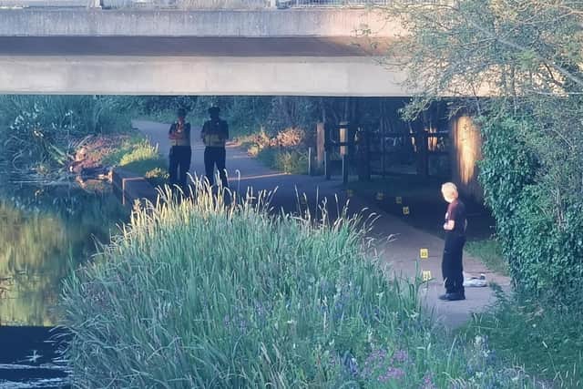 Police guarding what the crime scene along the Grand Union Canal footpath next to Hunsbury Meadows at 8.30pm tonight (Sunday). Photo: Logan MacLeod