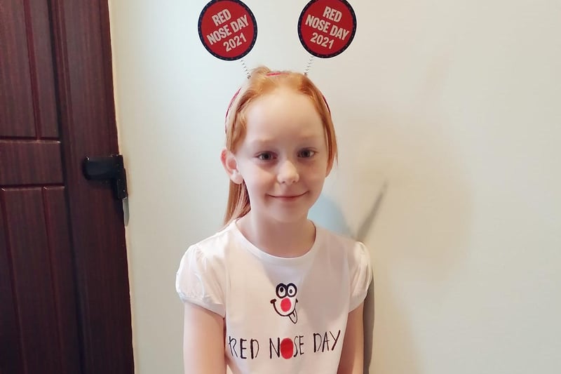 Eva, age 7, has the perfect headband for Comic Relief.