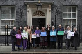 Green Party MP Hannah Spencer (third left) and actor Anna Maxwell Martin (fifth left) with parents and campaigners from No School Fines delivering a petition to number 10 Downing Street, London, calling on the government to stop fining parents for their child's non-attendance at school. Picture: Stefan Rousseau/Press Association