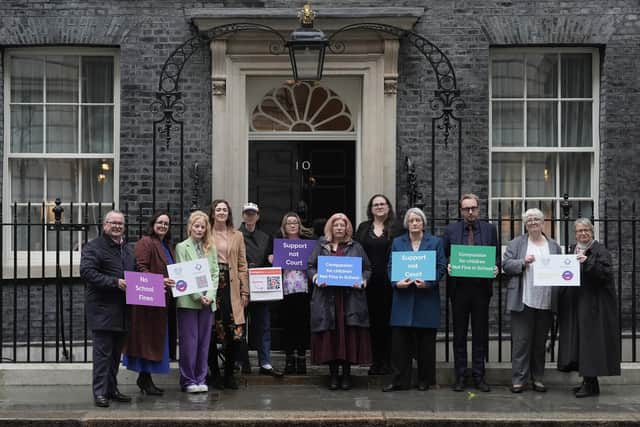 Green Party MP Hannah Spencer (third left) and actor Anna Maxwell Martin (fifth left) with parents and campaigners from No School Fines delivering a petition to number 10 Downing Street, London, calling on the government to stop fining parents for their child's non-attendance at school. Picture: Stefan Rousseau/Press Association