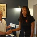 Cheque presentation from Tony Billson, former president of Rotary Nene Valley, to Lorraine Lewis