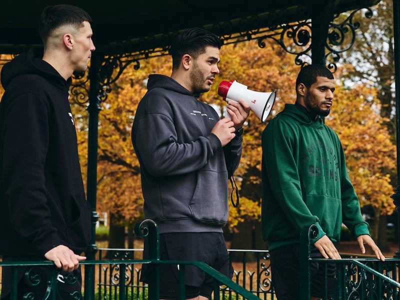 Alex Le Guevell (centre) and boxers Kieron Conway (left) and Michael Stephenson took to the Abington Park bandstand to talk to the runners