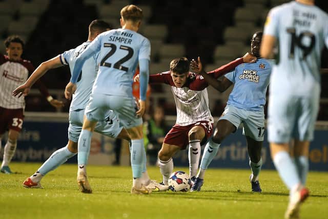 Liam Cross battles for possession against Cambridge United (Picture: Pete Norton)