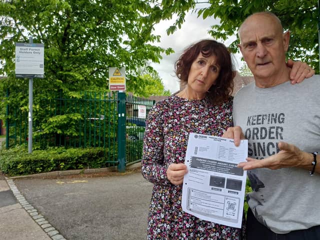 Brian and Jo Elijah-Sigston outside Whitefield Surgery staff car park