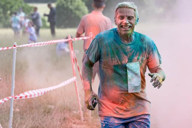 One participant having fun at Colour Run 2024