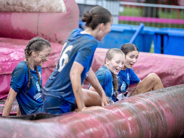 All smiles as participants tackled obstacles during Race for Life's Pretty Muddy on Saturday July 13, 2024 in Abington Park.