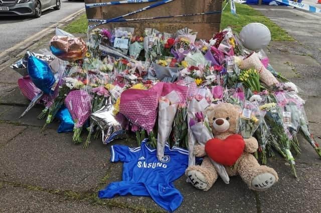 Flowers, messages, balloons and football shirts began to be laid at the war memorial in Harborough Road from the day after the incident (March 23).