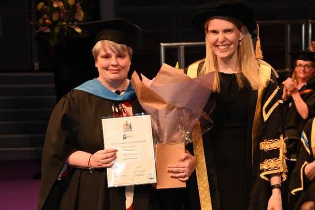 Hayley receiving her Hero award presented by Professor Anne-Marie Kilday, Vice Chancellor of the University of Northampton.