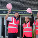 B&amp;DWC - SGB-15211 - Barratt Homes staff outside the Bertone Gardens sales centre in their pink PPE