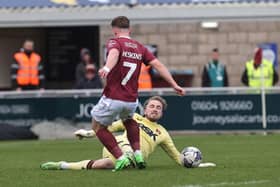 Sam Hoskins forces Harry Isted into a mistake before Louis Appéré equalises for the Cobblers against Charlton Athletic.