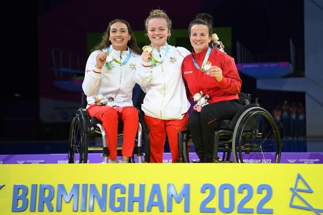 Silver medalist Grace Harvey (left) and bronze medalist Camille Berube (right) flank Maisie Summers-Newton