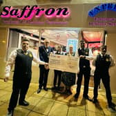 Saffron staff present the cheque to the Mayor of Northampton, Cllr Dennis Meredith