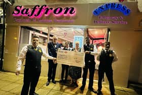 Saffron staff present the cheque to the Mayor of Northampton, Cllr Dennis Meredith