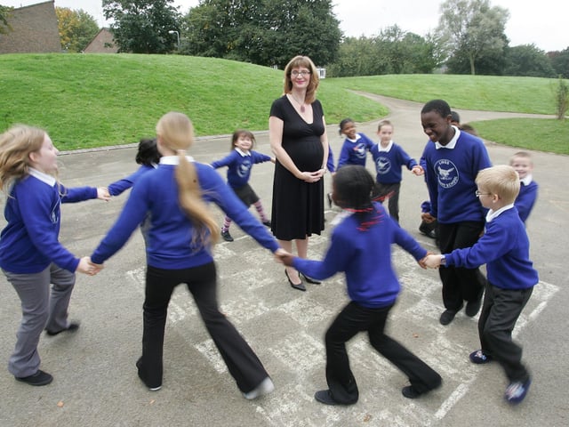 Head teacher Laura Suffield at Lings Primary School with pupils celebrate good Ofsted.