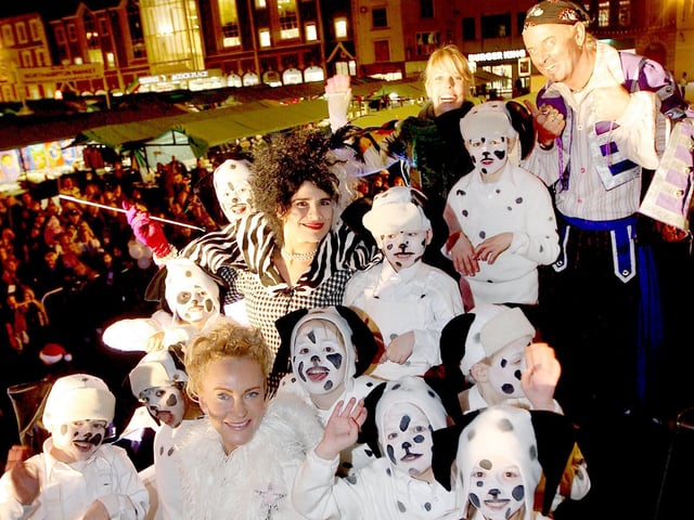 The cast of 101 Dalmatians and Peter Pan on their open top bus in 2007.