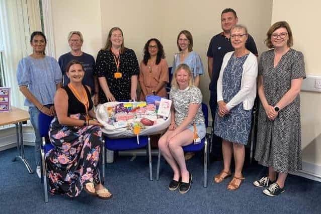 The Baby Basics Northampton team, pictured, work to produce starter packs for new mothers, which is packed in a moses basket and contains baby clothing, toiletries for both the mother and newborn, and a pick-me-up box of chocolates, among much more.