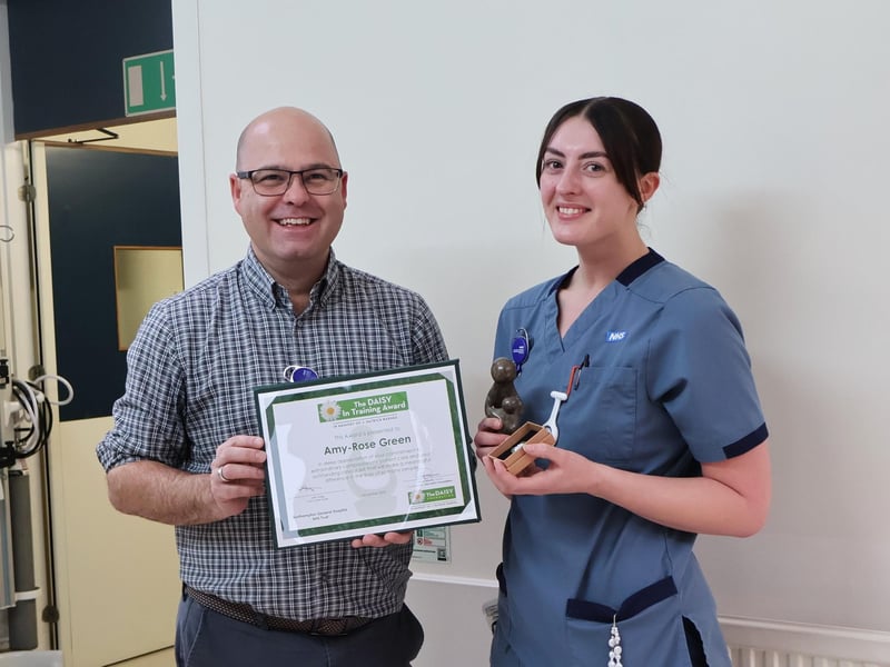 DAISY in Training Midwife Amy-Rose Green receives her award from Director of Nursing Robin Binks