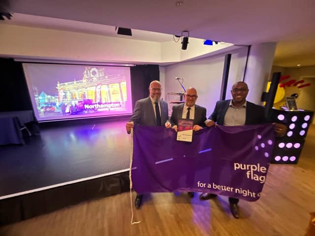Mark Mullen and Charlie Childs collecting Noerthampton's Purple Flag accreditation