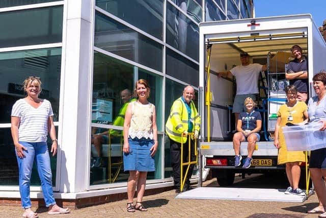 The community rallied around to help midwives during the relocation – pictured here unpacking.