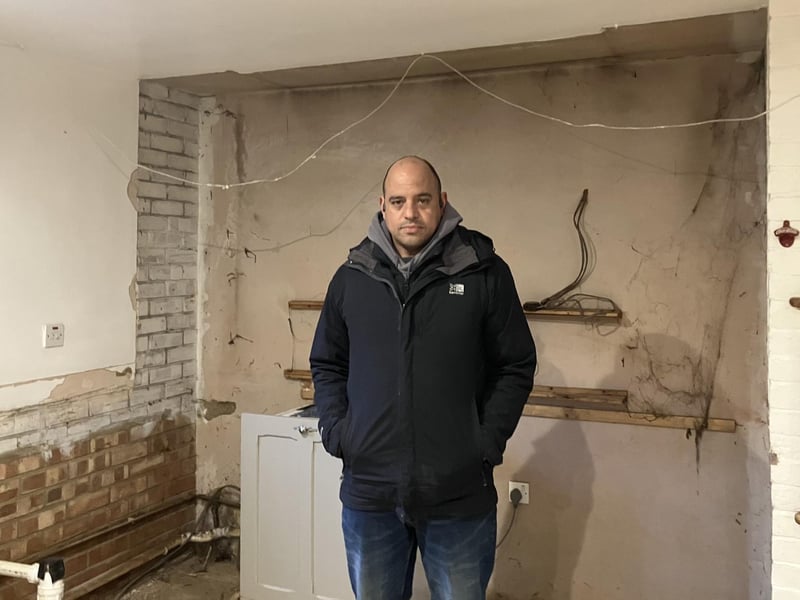 Jason Fletcher stood in his empty home which has been gutted out due to water damage from the flooding. (Image: Nadia Lincoln LDRS)