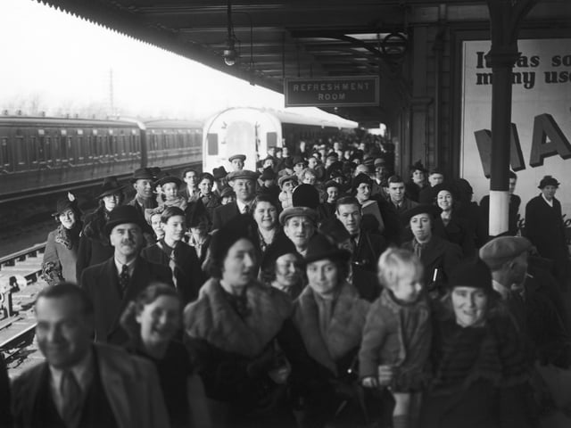 Parents and relatives of evacuees waiting for the arrival of the London Midland and Scottish Railway's Evacuation Special at Northampton railway station, 3rd December 1939. Special cheap excursions have been arranged to enable parents to visit evacuated children in the reception areas. (Photo by J. A. Hampton/Topical Press Agency/Hulton Archive/Getty Images)