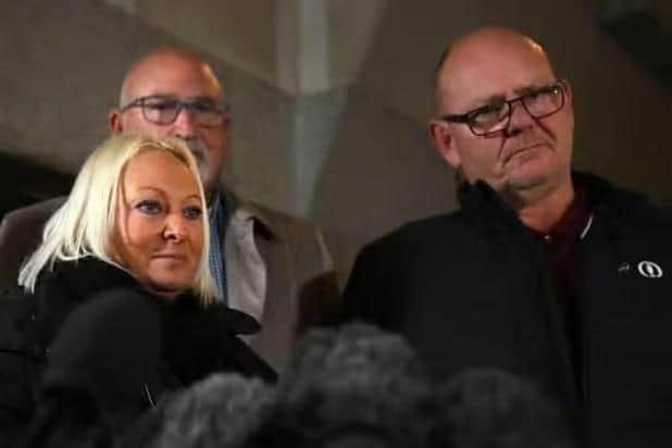 Harry Dunn's family (front) and spokesman Radd Seiger (back).