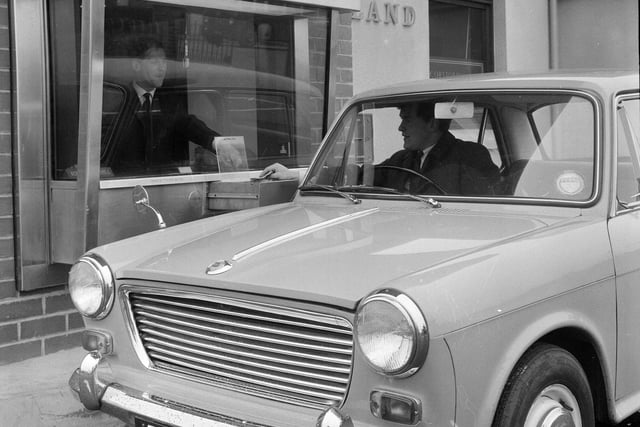 Customers use the new 'drive in' bank at 206 St John Road in March 1964.