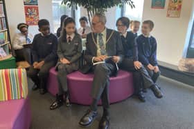 Mayor of Northampton Cllr Dennis Meredith meets pupil librarians during the official opening of Northampton International Academy's primary library 