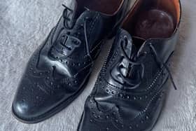 Gone, but never forgotten. John's black shoes.