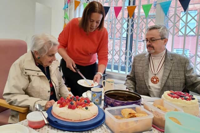 Joy Griffiths-Elsden with Alex Dovaston and John Griffiths-Elsden DL at the Charity Bake-Off 2023 in Northampton