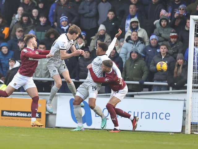Sean Raggett scores Portsmouth's first goal in their 3-0 win against the Cobblers at Sixfields in December (Photo by Pete Norton/Getty Images)