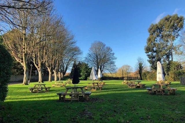 The village pub has a huge lawn area with plenty of benches for all to enjoy the sunshine.