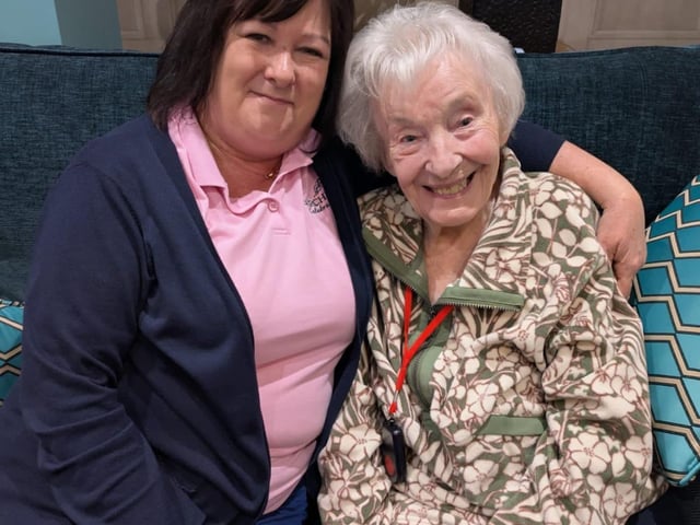 Activities Assistant Julie with resident Annette Having fun during the event