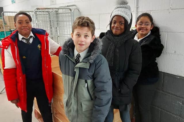 Pupils from Stimpson Avenue Academy deliver their Reverse Advent Calendar donations to the Hope Centre
