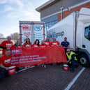 The team from NX Group unveil new branding on their lorries to help raise awareness of motor neurone disease and the work of the MND Association.
